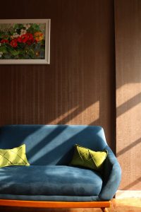 Assorted patterned cushion covers displayed on a sofa