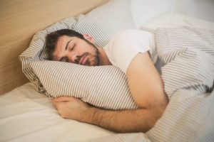 Person sleeping comfortably on a cool pillow