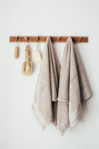 Neatly folded stack of cotton pillowcases in various colours